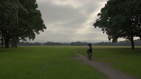 Cycling in park Stock Footage 137449798