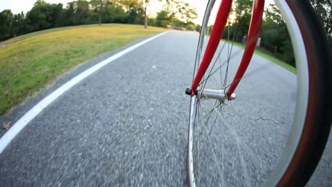 Cycling on a paved bike path, first-person perspective Stock Footage 310706243