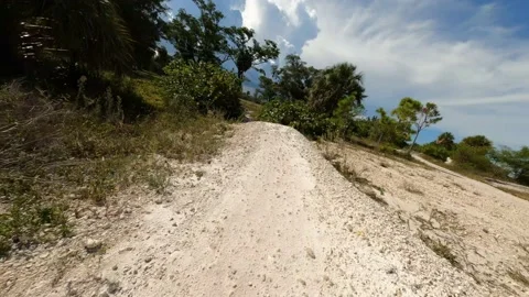 Cycling Rounding Bend Going Over Hill Stock Footage 205511538