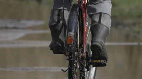 Cycling in rubber boots, close-up, 4K slomo Stock Footage 237521706