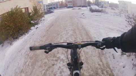 Cycling in the snow, begin Stock Footage 57980042