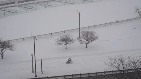 Cycling in the snow Stock Footage 148516405