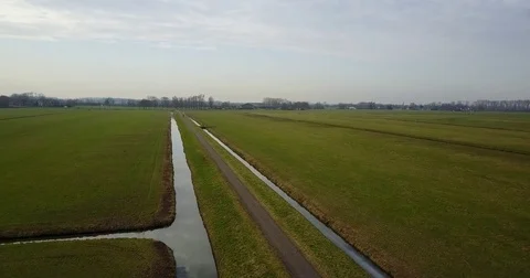 Cycling through Dutch landscape Stock Footage 72569034