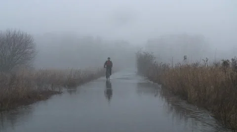 Cycling through floods Stock Footage 34269610