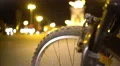 Cycling tour around big city at night, defocused traffic in illuminated street 4k or 4k+ Resolution