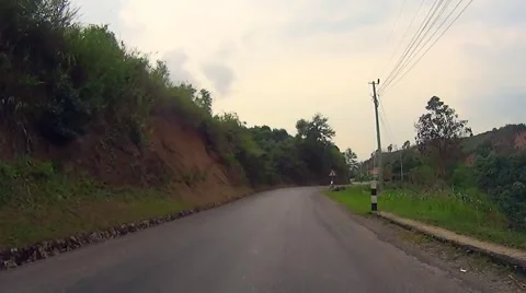 Cycling touring downhill in Laos. Stock Footage 50991981