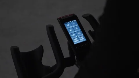 Cycling trainer computer screen. Spinning workout on stationary cycling trainer Video stock 103430615