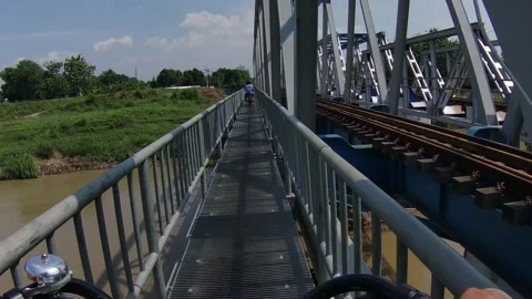 Cycling On A Very Small Bridge Over Big River Alongside Railways Видео 210550043