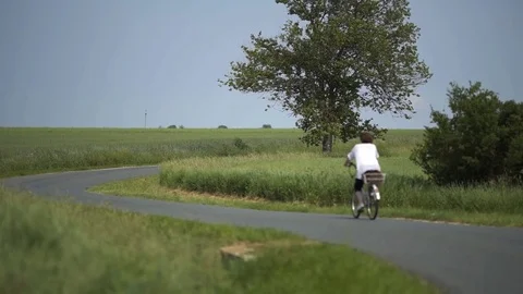 Cycling at the wheat land Stock Footage 78530560