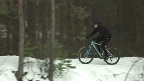 Cycling in the winter. 2 Shots. Stock Footage 124330577