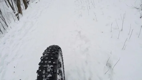 Cycling in the winter forest. Action camera shot. Type front wheel. Stock Footage 71792595
