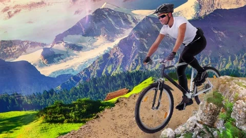 Cyclist in action or driving on a mountain highway, circling the road. Mountains Stock Footage 130405577