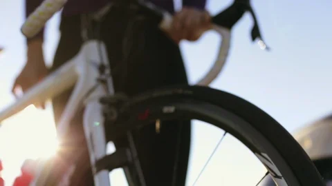 Cyclist adjusting her bicycle. Stock Footage 88444633
