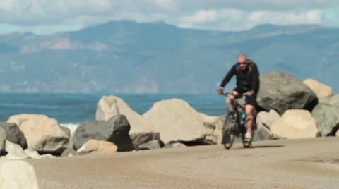 Cyclist by the beach Stock Footage 46808239