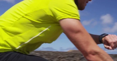 Cyclist biking looking at smartwatch while riding road bike - Cycling athlete Stock Footage 83156439
