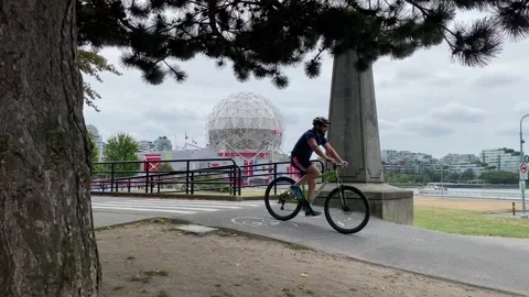 Cyclist on biking trail path in Vancouver Stock Footage 281703864
