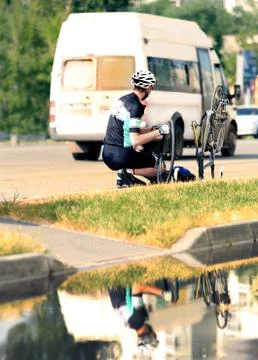 Cyclist with the broken bicycle Stock Photos