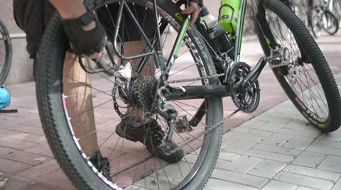 Cyclist caring for his bicycle Stock Footage 53786932