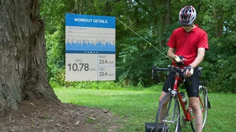 Cyclist Checking Exercise Progress on Smart Phone with Graphics 스톡 동영상 77922589