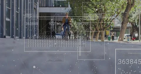 Cyclist crossing data threshold, generating technology overlays mapping speed Stock Footage 328088015