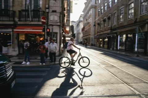 Cyclist crossing an intersection in the city Stock Photos