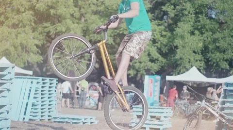 Cyclist doing jump MTB tricks in bicycle HD high speed video. Extreme sport Stock Footage 67861432