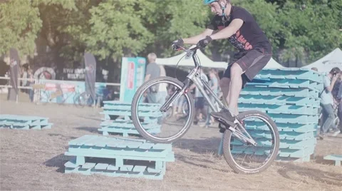 Cyclist doing jump MTB tricks in bicycle HD speed video. Mountain bike trial Stock Footage 67861465