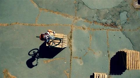 Cyclist doing jump MTB tricks in bicycle 4k aerial video Mountain bike trial Stock Footage 67862165