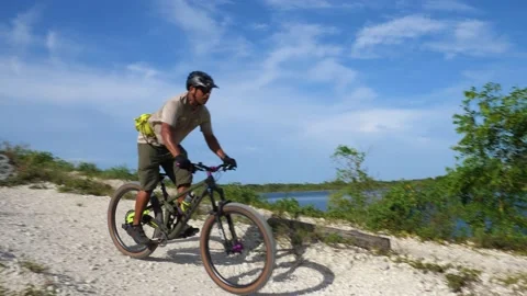 Cyclist Down Off Advanced Hilltop Rides By Us Stock Footage 203307461