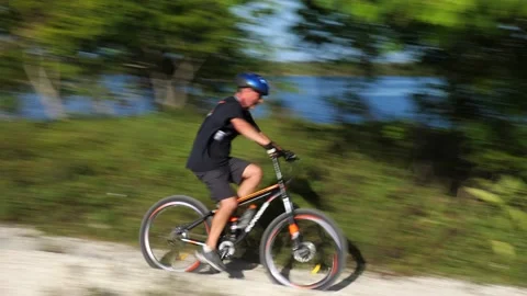 Cyclist Down Hilltop Around Bend Up Another Hilltop Stock Footage 203298186