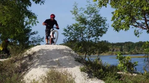 Cyclist Down Hilltop Around Bend Up Another Hilltop Stock Footage 203308077