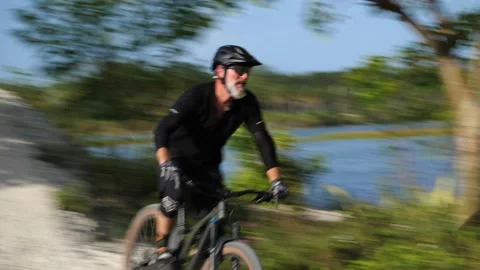 Cyclist Down Hilltop Around Bend Up Another Hilltop Stock Footage 203308534