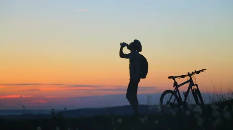 A cyclist drinking water Stock Footage 67595175