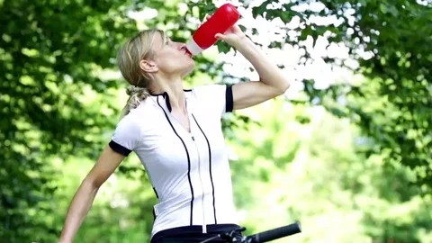 A cyclist drinks water. Stock Footage 112351129