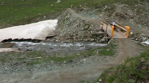 Cyclist falling after bridge Stock Footage 33061596
