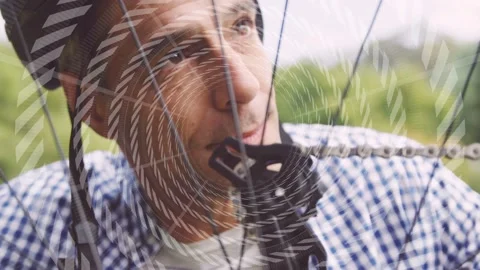 Cyclist feeling chain, tweaking through spokes, nudging derailleur to align Stock Footage 332505310