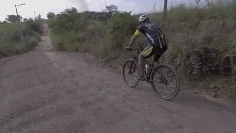 Cyclist going down hill at high speed Stock Footage 216237421