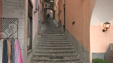 Cyclist going down a stairway Stock Footage 32318161