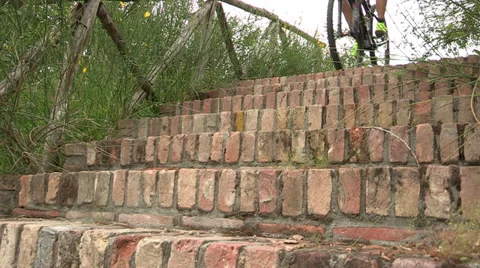 Cyclist going down stairway Stock Footage 36696713