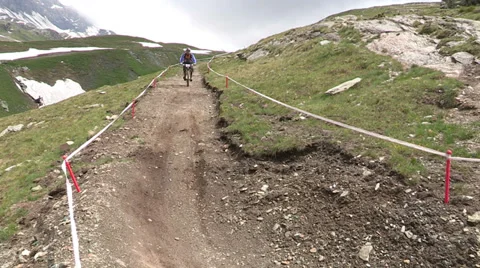 Cyclist going downhill Stock Footage 33061574