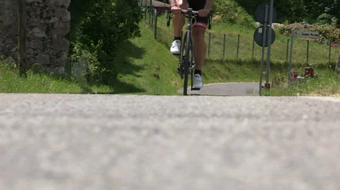 Cyclist going on small road Stock Footage 36971577