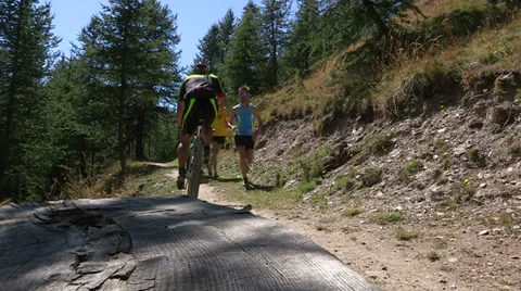 Cyclist going uphill on trail Stock Footage 37586978