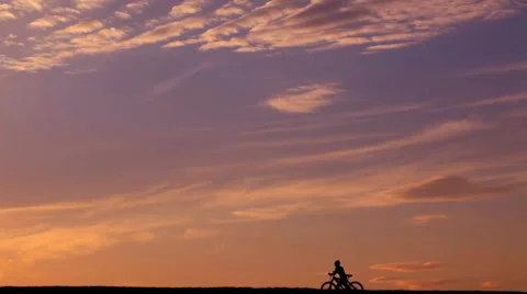 Cyclist on the horizon Stock Footage 54894965