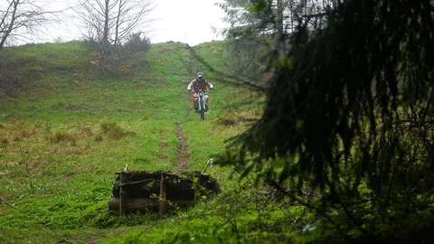 The cyclist jumps from the springboard Stock Footage 107659056