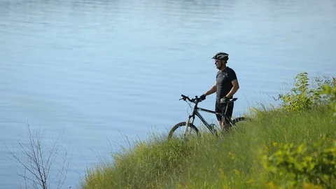 Cyclist Looks Away Stock Footage