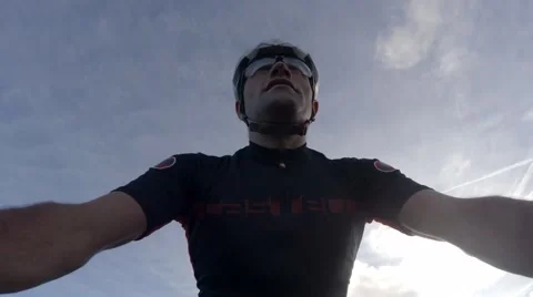 A cyclist low view from handlebars while riding his mountain bike Video stock 58214898
