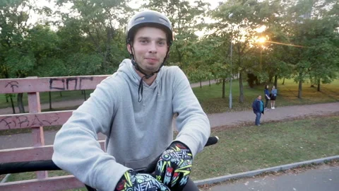 Cyclist makes a hand gesture and says something Stock Footage 103246423
