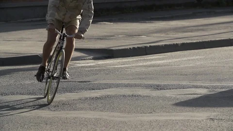 Cyclist man riding bicycle at empty street. Close-up. Ecological urban transport Stock Footage 108370974