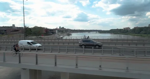 Cyclist on a modern bridge Stock Footage 100342422