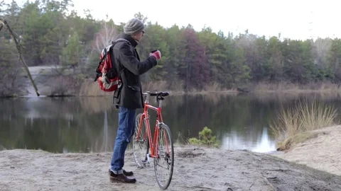 Cyclist on the Nature Drinking Tea Stock Footage 71463926